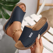 Comfortabele instap slippers met sleehak - Noëlle