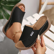 Comfortabele instap slippers met sleehak - Noëlle