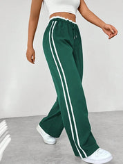 Dames Sportbroek met Zijstrepen – Wijde Pijpen en Elastische Taille
