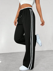 Dames Sportbroek met Zijstrepen – Wijde Pijpen en Elastische Taille