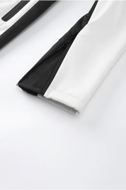 Elegant aansluitend dames skipak met riem en contrasterende details