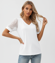 Elegante dames top met transparante stipmouwen – Elin