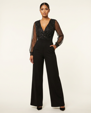 Elegante zwarte dames jumpsuit met transparante mouwen