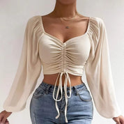 Gerimpte crop blouse met sheer mouwen – Aura