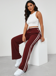 Sportieve wide leg broek met hoge taille en contrasterende strepen