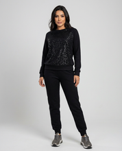 Trendy damespak met subtiele glansdetails