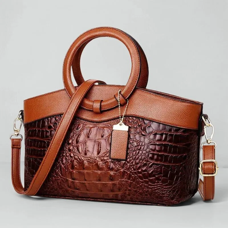 Vintage handtas met crocostructuur en schouderriem