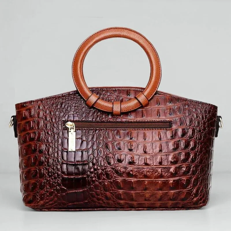 Vintage handtas met crocostructuur en schouderriem