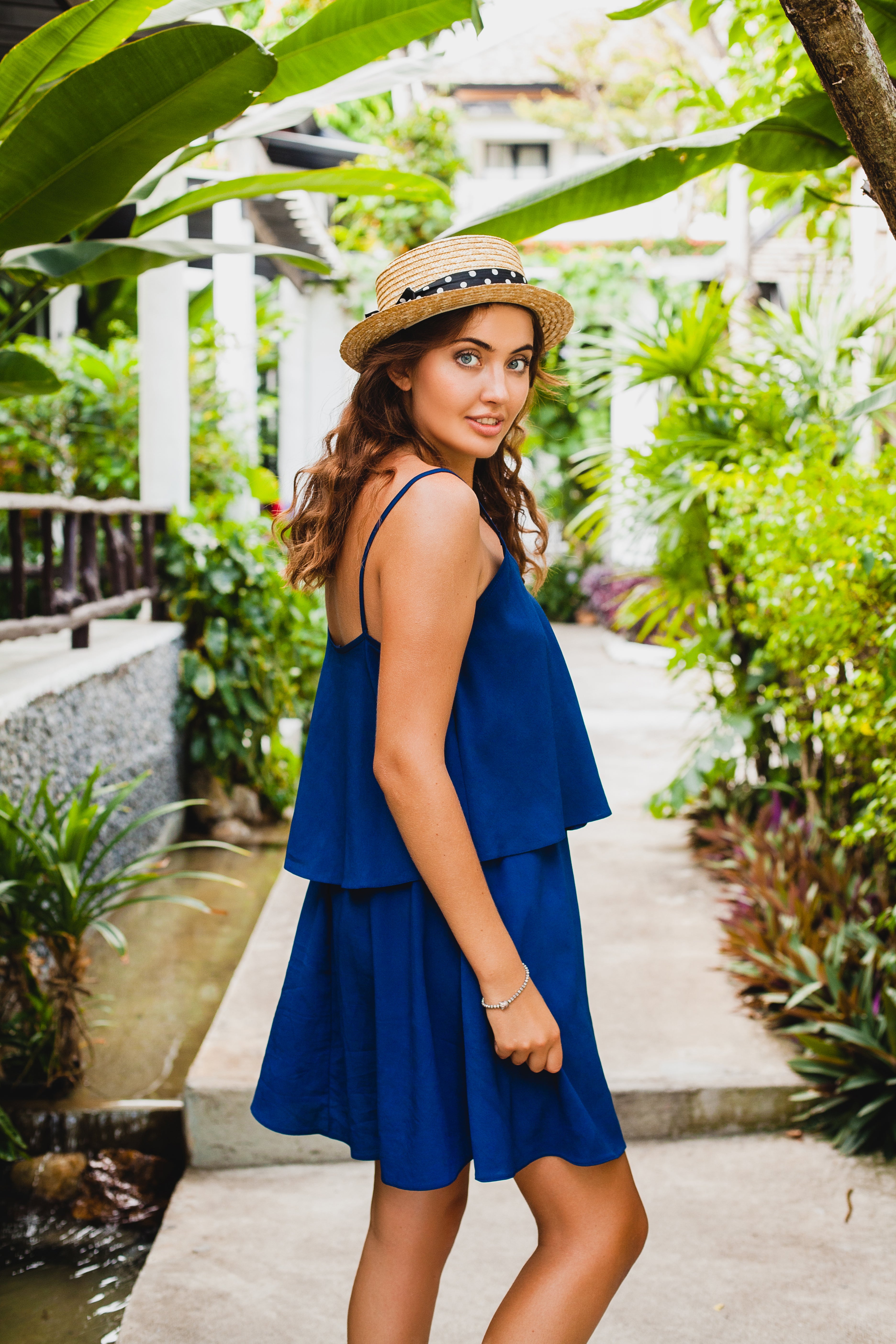 attractive-young-woman-blue-dress-straw-hat-wearing-pink-sunglassses-walking-tropical-spa-villa-hotel-vacation-summer-style-outfit-sexy.jpg